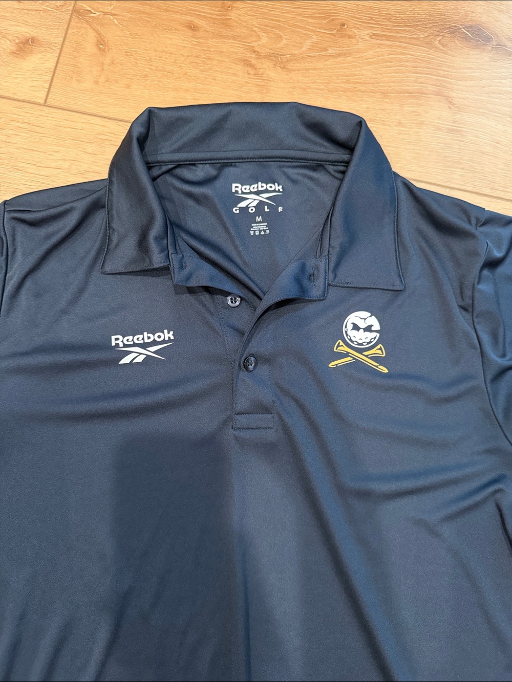 Reebok Black Golf Polo with Skull & Crossed Clubs Patch